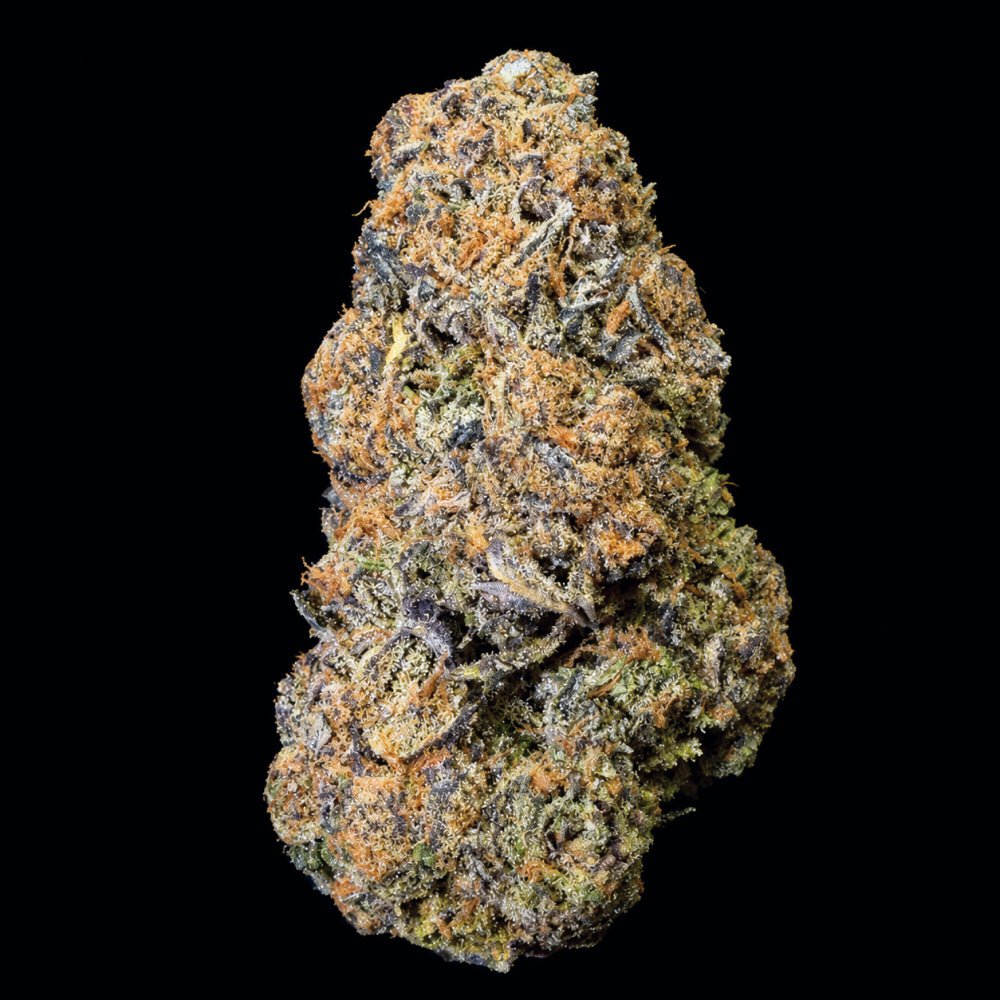 Dense cannabis flower bud with brown and green trichomes against black background